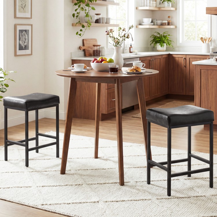 Set of 2 black counter height bar chairs with ergonomic saddle seats, ideal for kitchen islands or dining areas.