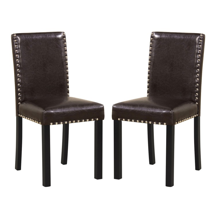 Set of 2 dining chairs with faux leather upholstery and nailhead accents, ideal for kitchen or dining areas.