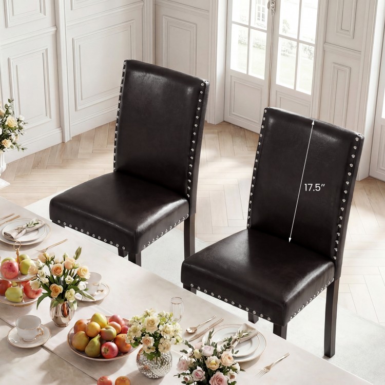 Set of 2 faux leather dining chairs with nailhead accents, featuring solid wood legs and a 17.5" seat height for.