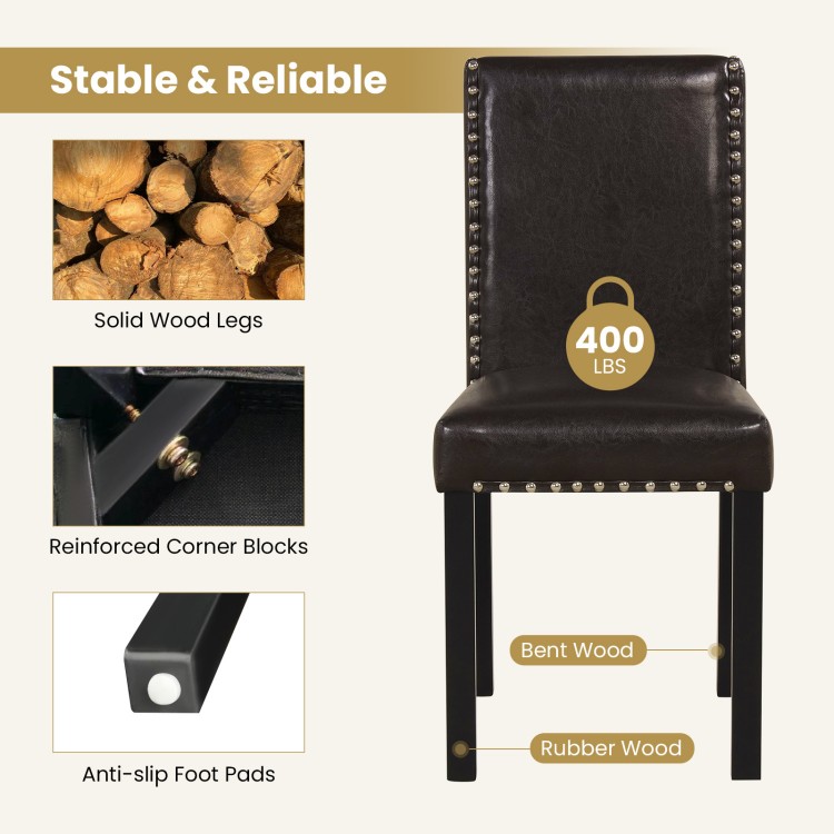Dining chair with faux leather upholstery, solid rubber wood legs, and elegant nailhead accents for versatile dining.