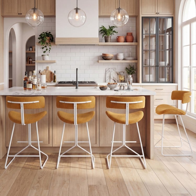 Set of 2 orange counter height stools with padded seats and footrests, perfect for 34"-36" high tables.