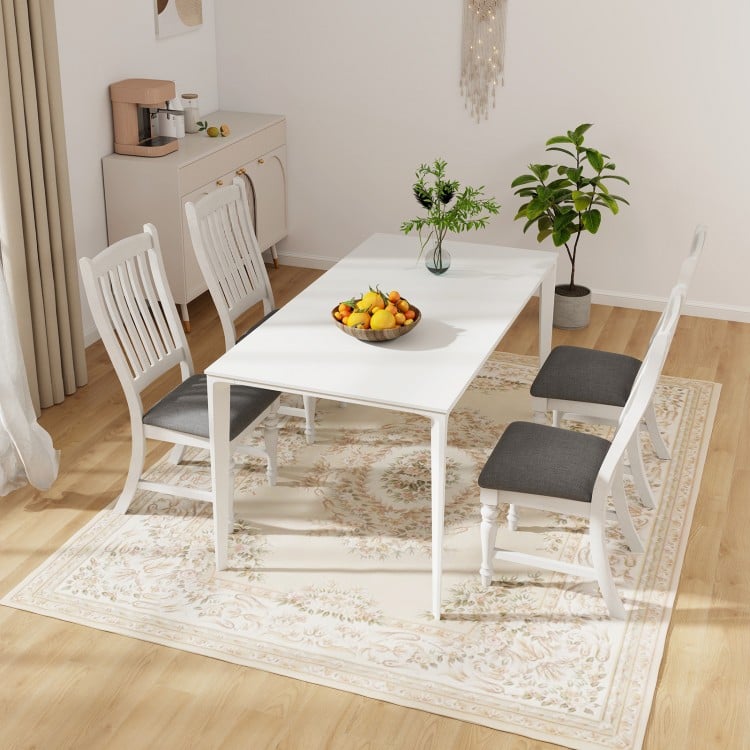 Set of 2 white dining chairs with solid wood legs and thick cushions, ideal for kitchen or dining room use.