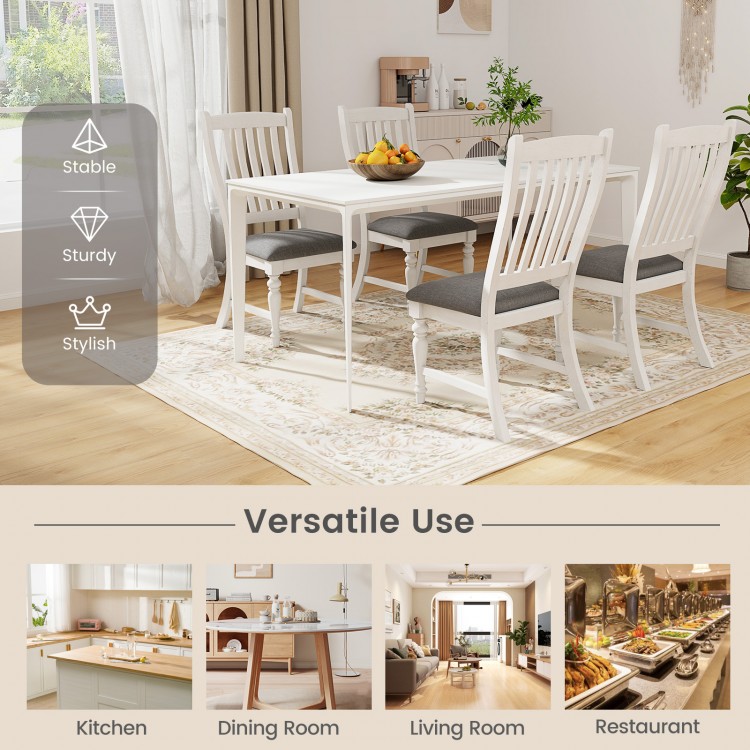 Set of 2 white dining chairs with solid wood legs, featuring a thick cushion and stylish design for versatile use.