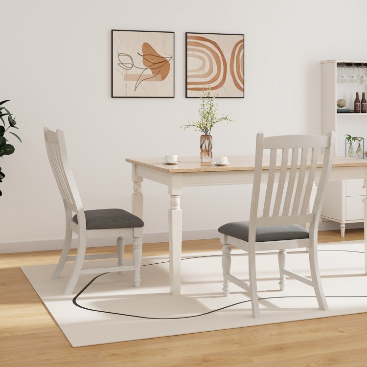 Set of 2 white dining chairs with solid wood legs and thick cushions, perfect for kitchen or dining room use.