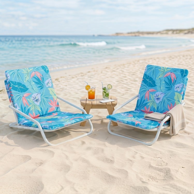 Two folding beach chairs with sponge padded seats in a vibrant color scheme, perfect for beach days and camping trips.