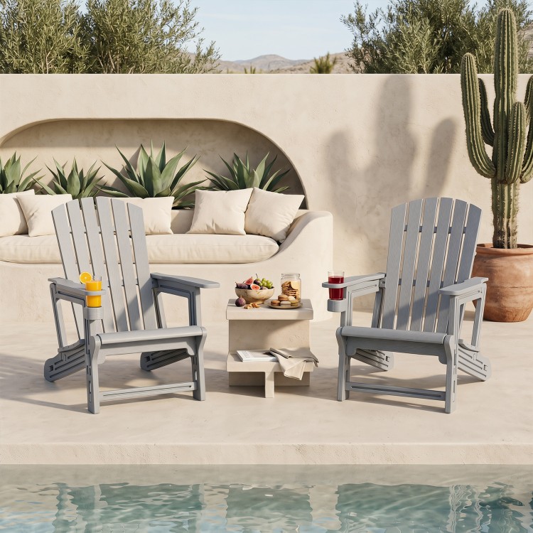 Two gray HDPE Adirondack chairs with cup holders and wood-like texture, perfect for relaxing by the poolside.