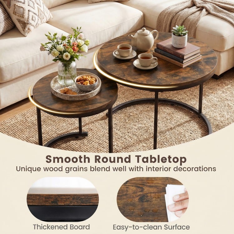 Set of 2 rustic brown round nesting coffee tables with smooth surfaces, perfect for living room or bedroom use.