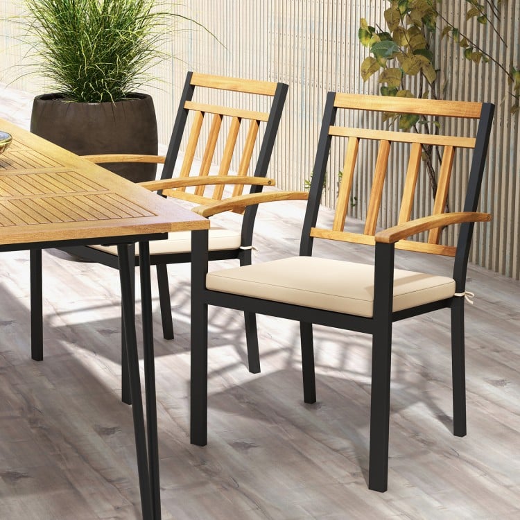 Set of 2 patio dining chairs with acacia wood armrests and removable cushions, perfect for outdoor dining comfort.