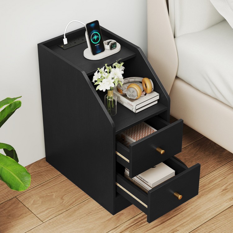 Black side end table with charging station, two drawers, and open shelf for organized storage beside a sofa or bed.