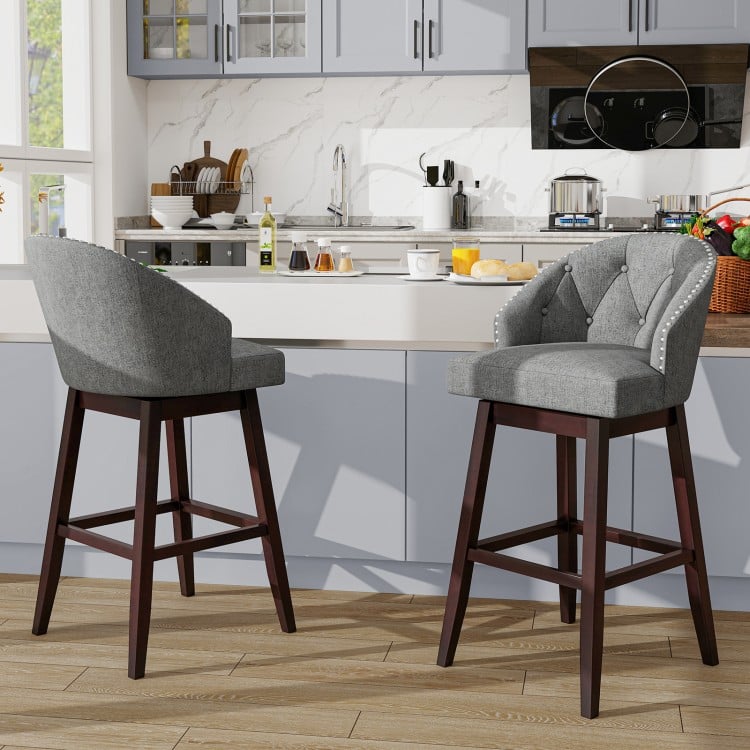 Set of 2 gray swivel bar stools with rubber wood legs and padded backrest, ideal for kitchen islands or cafes.