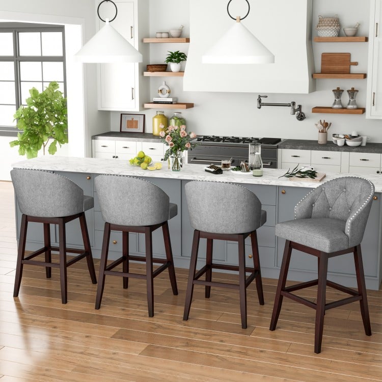 Single gray swivel bar stool showcasing rubber wood legs, padded backrest, and 360° swivel for versatile kitchen.