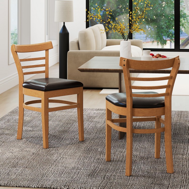 Set of 2 wooden dining chairs with rubber wood legs and brown PU leather seats, perfect for restaurants or dining rooms.