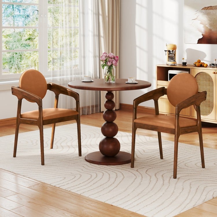Set of 2 brown wooden dining chairs with PU leather upholstery, featuring curved backrests and armrests for comfort.