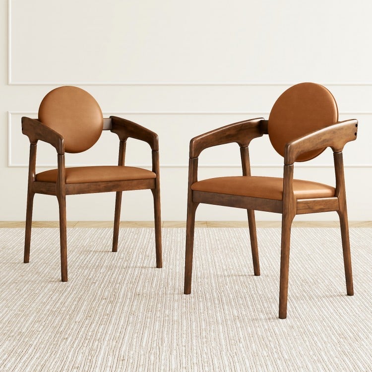 Set of 2 brown wooden dining chairs with PU leather upholstery and curved backrests, perfect for dining areas.