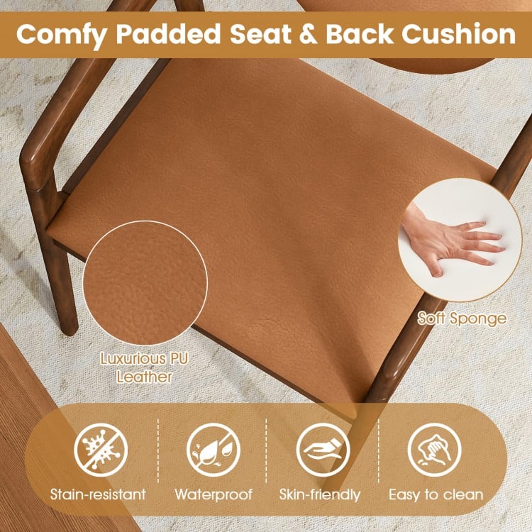 Brown PU leather padded seat and back cushion of a wooden dining chair, offering comfort and easy cleaning for dining.