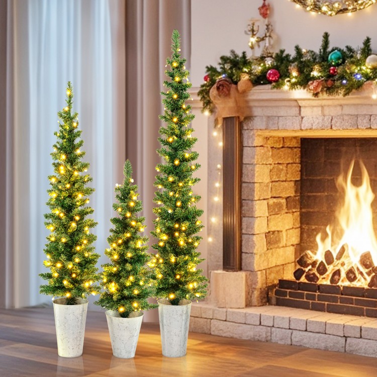 Set of 3 pre-lit artificial Christmas trees with warm white LED lights, ideal for festive home decoration.