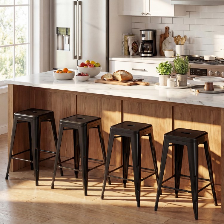 Set of 4 black metal bar stools with backrests and footrests, perfect for kitchen islands or home bars.