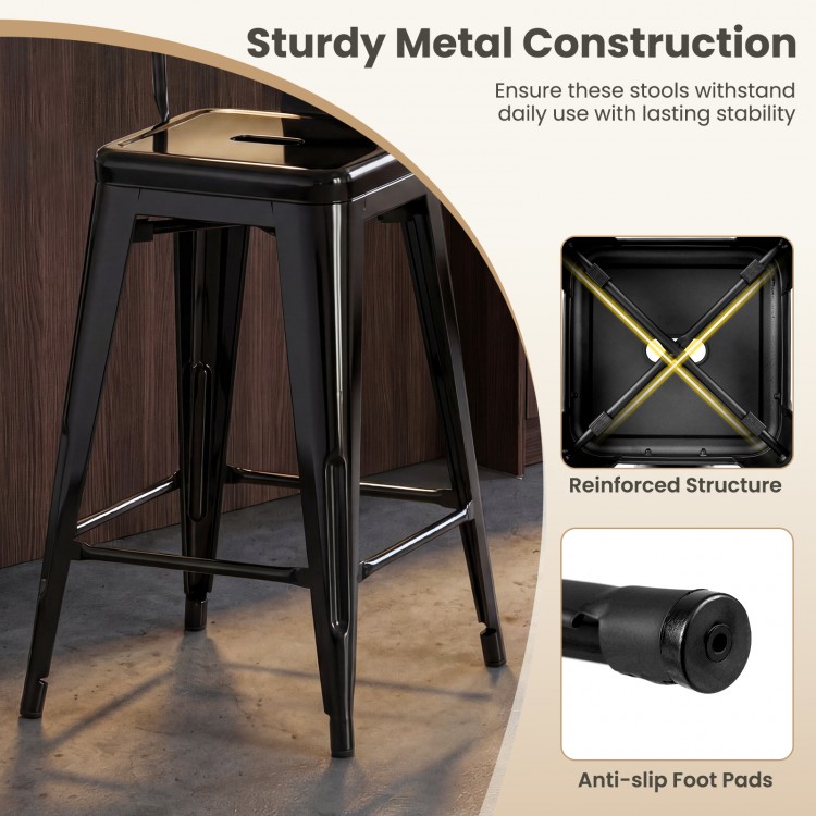 Black metal bar stool with backrest and footrest, featuring a stackable design and anti-slip foot pads for stability.
