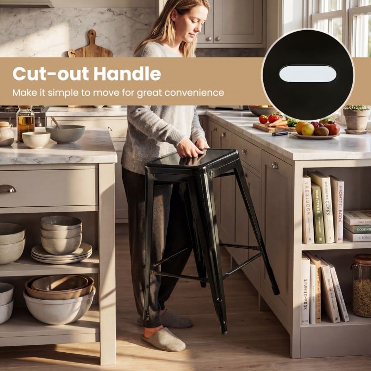 Black metal bar stool with cut-out handle, stackable design, and ergonomic backrest for kitchen or home bar use.