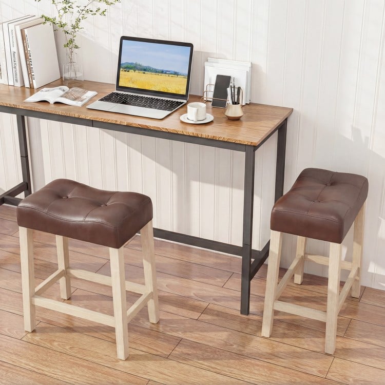 Upholstered counter height bar stools with curved saddle-seat and tufted design, perfect for kitchen or bar use.