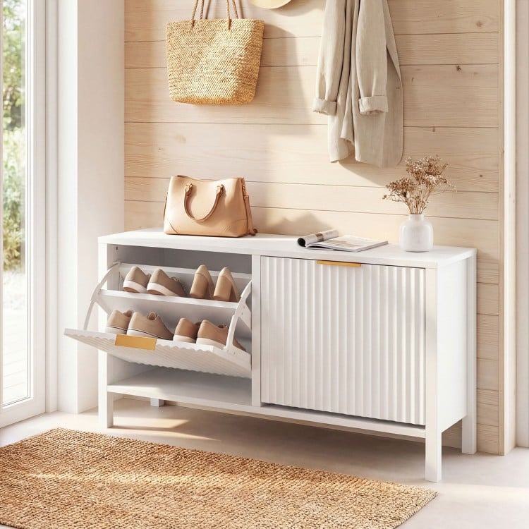 Narrow white shoe storage bench with two flip drawers and elegant fluted doors, perfect for entryways and hallways.