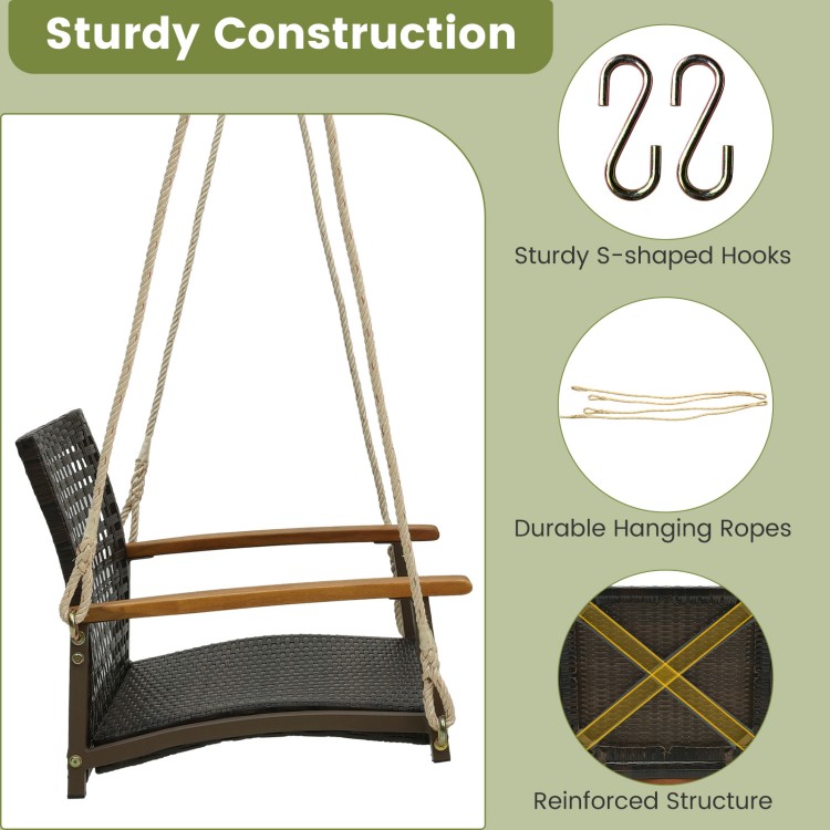 Single rattan porch swing with acacia wood armrests and cushion, featuring durable hanging ropes for outdoor use.
