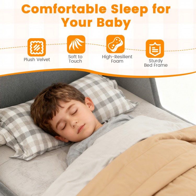 Soft velvet toddler bed frame in gray with safety rails, providing comfort and stability for a restful sleep.