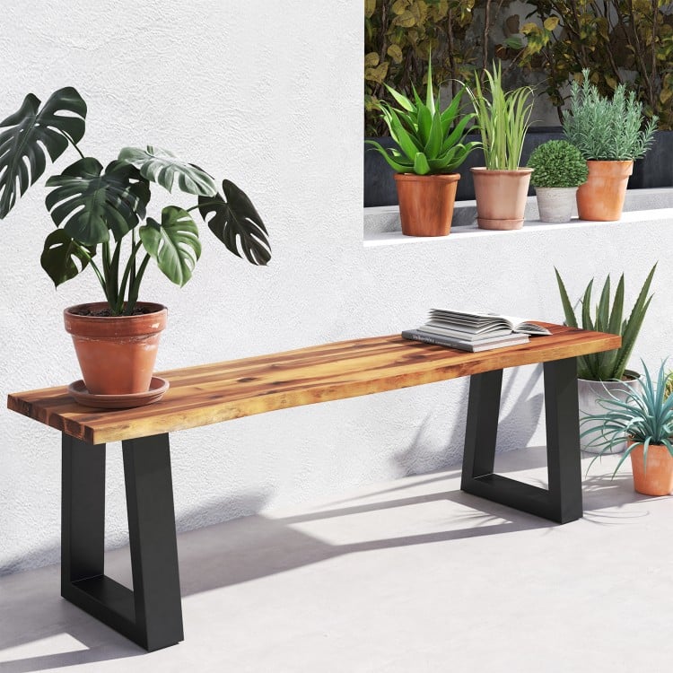 Solid acacia wood patio bench with metal legs, featuring a polished surface, ideal for outdoor dining and decor.