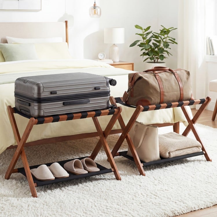 Solid rubberwood folding luggage rack set of 2 with nylon shelves, ideal for organizing bags and shoes in a bedroom.