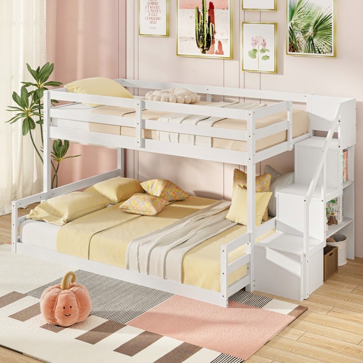 Twin over full low bunk bed in white with storage stairs, ideal for kids' rooms and featuring safety guardrails.