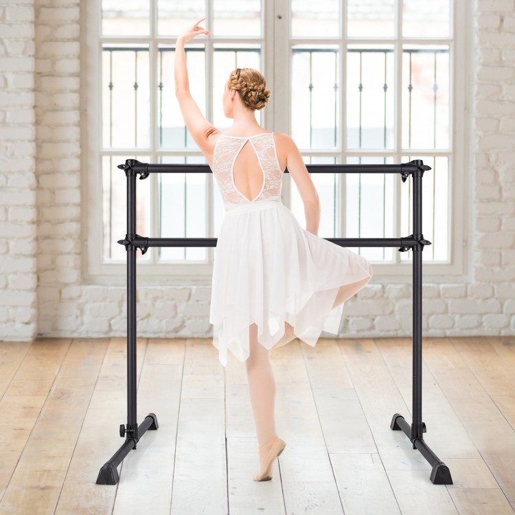 Freestanding black ballet barre for dancing and stretching, adjustable height from 7" to 46", ideal for home or studio.