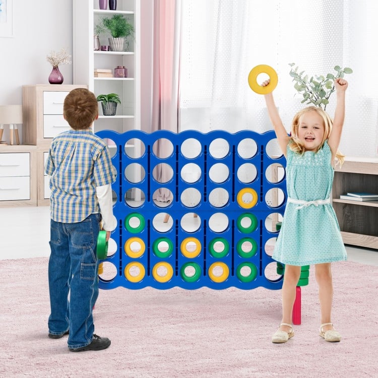 Children enjoying the Jumbo 4-to-Score Giant Game Set, featuring a lightweight design and vibrant rings for engaging.