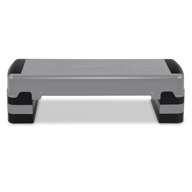 Adjustable 35-inch aerobic cardio stepper with risers, featuring a non-slip surface for versatile home and class.