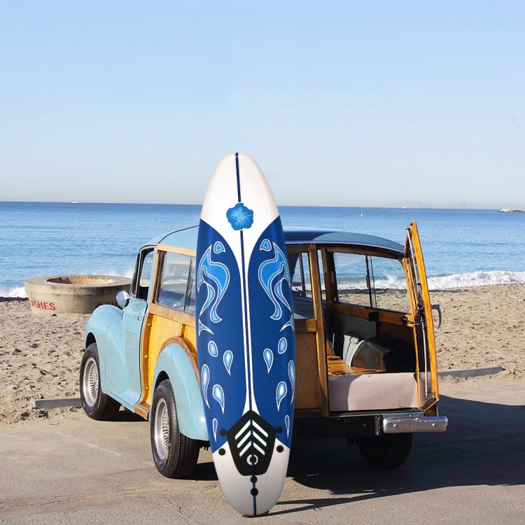 6-foot white surf foamie board with blue design, ideal for beginners, placed next to a vintage car on the beach.
