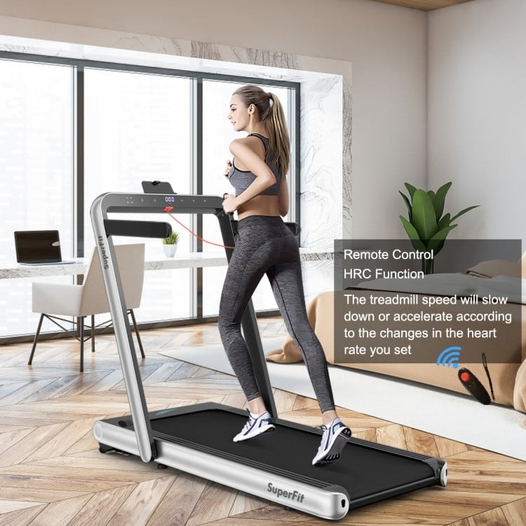 Folding treadmill with remote control and touch screen, offering 0.6-10.5mph speeds for fitness or under-desk use.