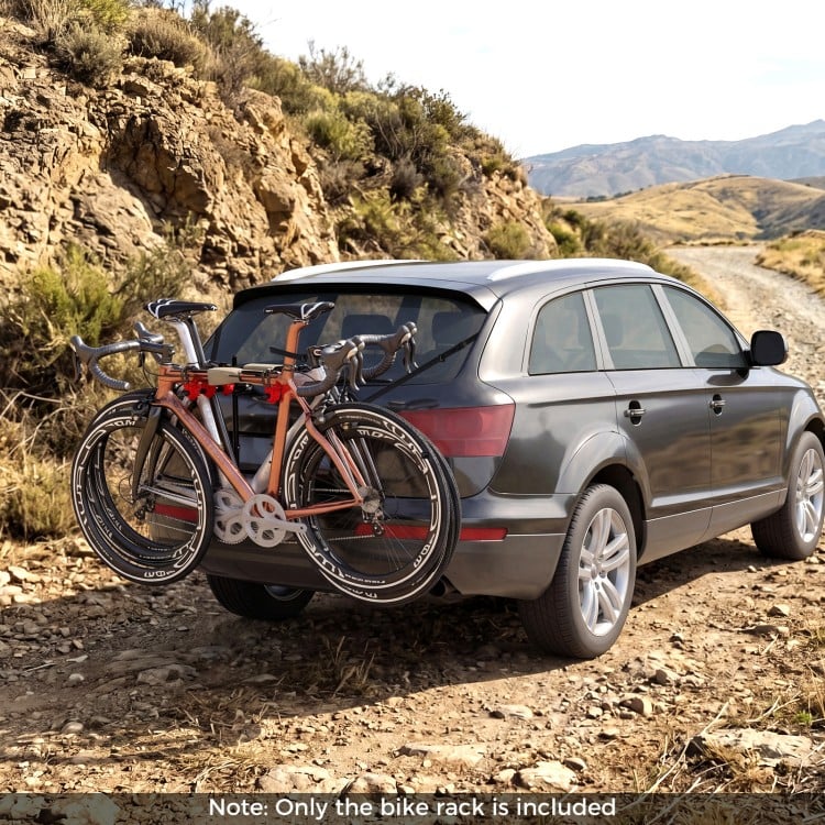 Trunk mount 3-bike rack on an SUV, featuring anti-sway straps and soft padding for secure transport of bicycles.