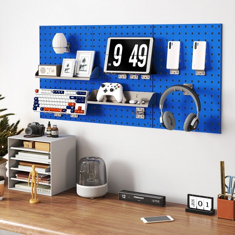 Navy wall-mounted pegboard kit with three 16" x 23.5" boards, hooks, shelves, and accessories for organized tool.