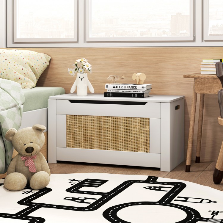 Kids rattan toy storage box in white with flip top lid, ideal for organizing toys in a child's room or playroom.