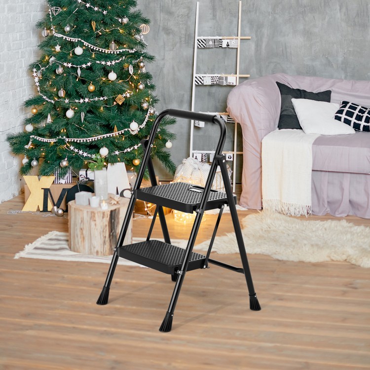 Portable folding 2-step ladder in black with anti-slip pedals, perfect for safe and convenient use in any home setting.