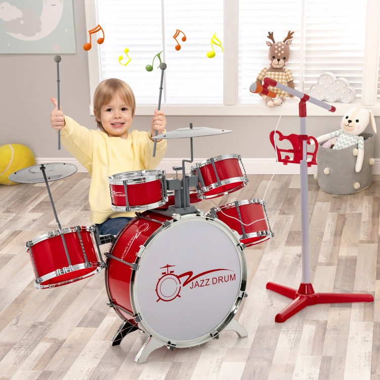 Kids jazz drum set in red with stool and microphone stand, featuring 8 drum sounds and adjustable height for fun music.