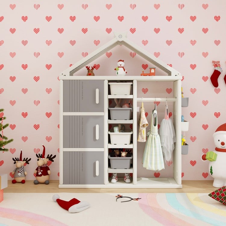 Kids costume storage closet in gray with bins and shelves, perfect for organizing toys and clothes in a child's room.