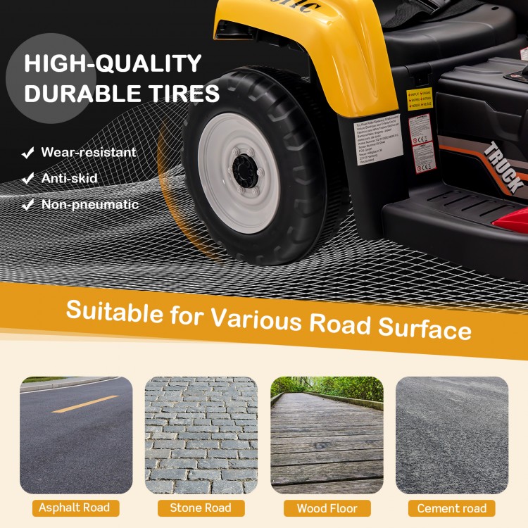 Close-up of the durable anti-skid tire of the yellow kids' ride-on excavator, designed for various road surfaces.