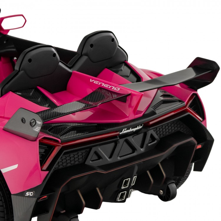 Rear view of the pink 12V Lamborghini kids ride-on car featuring a carbon fiber spoiler and LED lights for fun.