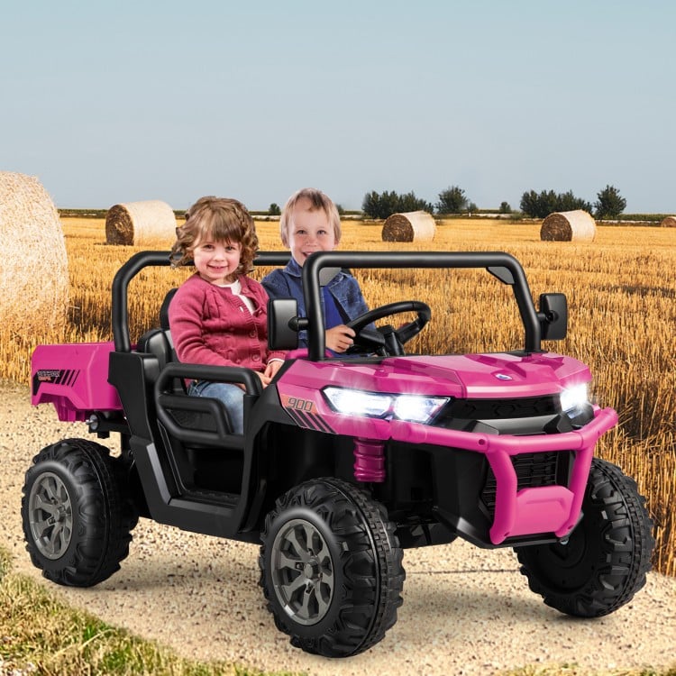 Kids ride in a pink 24V car with dump bed, featuring remote control, music, and safety belt for outdoor fun.