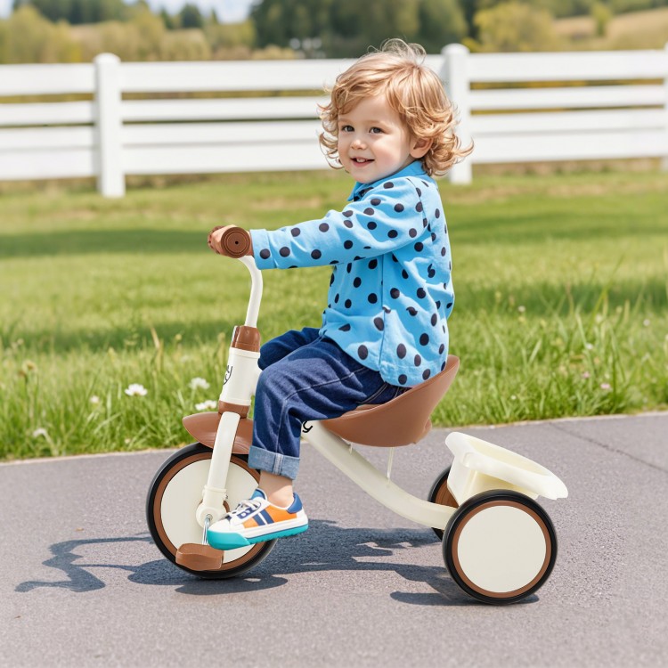 Toddler tricycle in beige with adjustable seat, ergonomic design, and rear basket for kids aged 3-5 years outdoors.