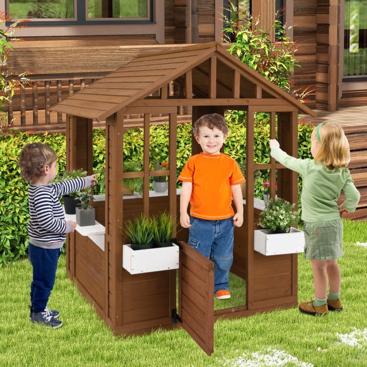 Outdoor playhouse made of fir wood with serving stations, door, and windows for kids aged 2 and up.