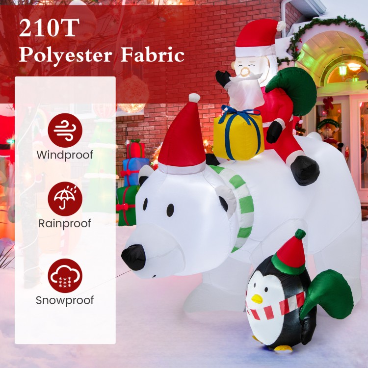 Inflatable Santa Claus riding a bear with a penguin, featuring LED lights and weather-resistant polyester for outdoor.