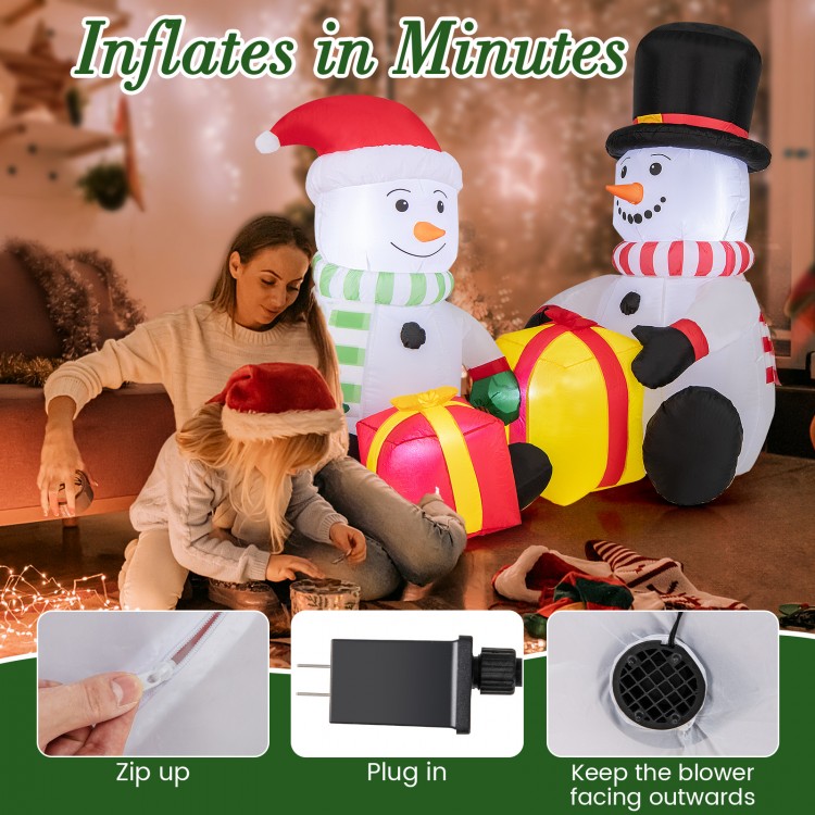 Cute 5-foot inflatable snowmen with gift boxes, pre-lit, made of durable polyester for festive indoor or outdoor decor.