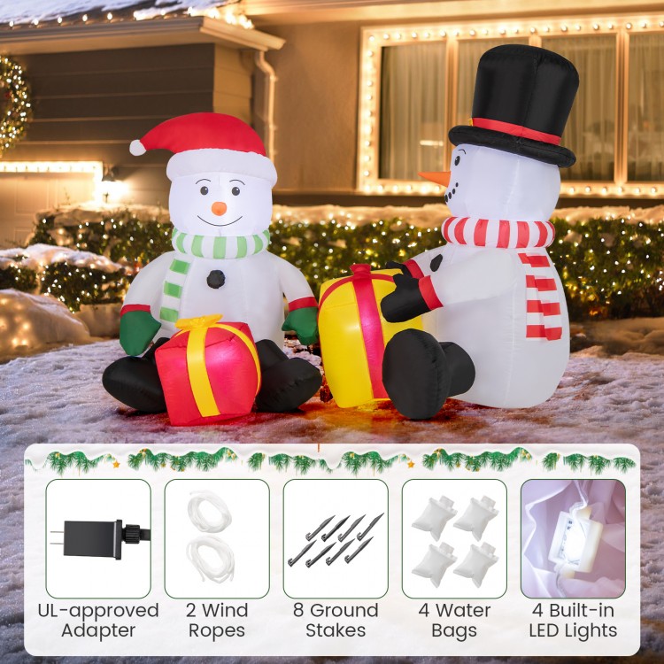 Cute 5-foot inflatable snowmen with gift boxes, pre-lit with 4 LED lights, perfect for festive outdoor holiday decor.