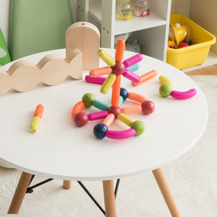 Colorful magnetic balls and rods set with various shapes for kids, promoting creativity and safe play in a playroom.